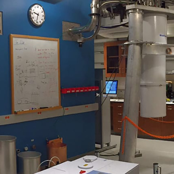 photo of a lab with countertops, cabinets, a whiteboard and electronic equipment